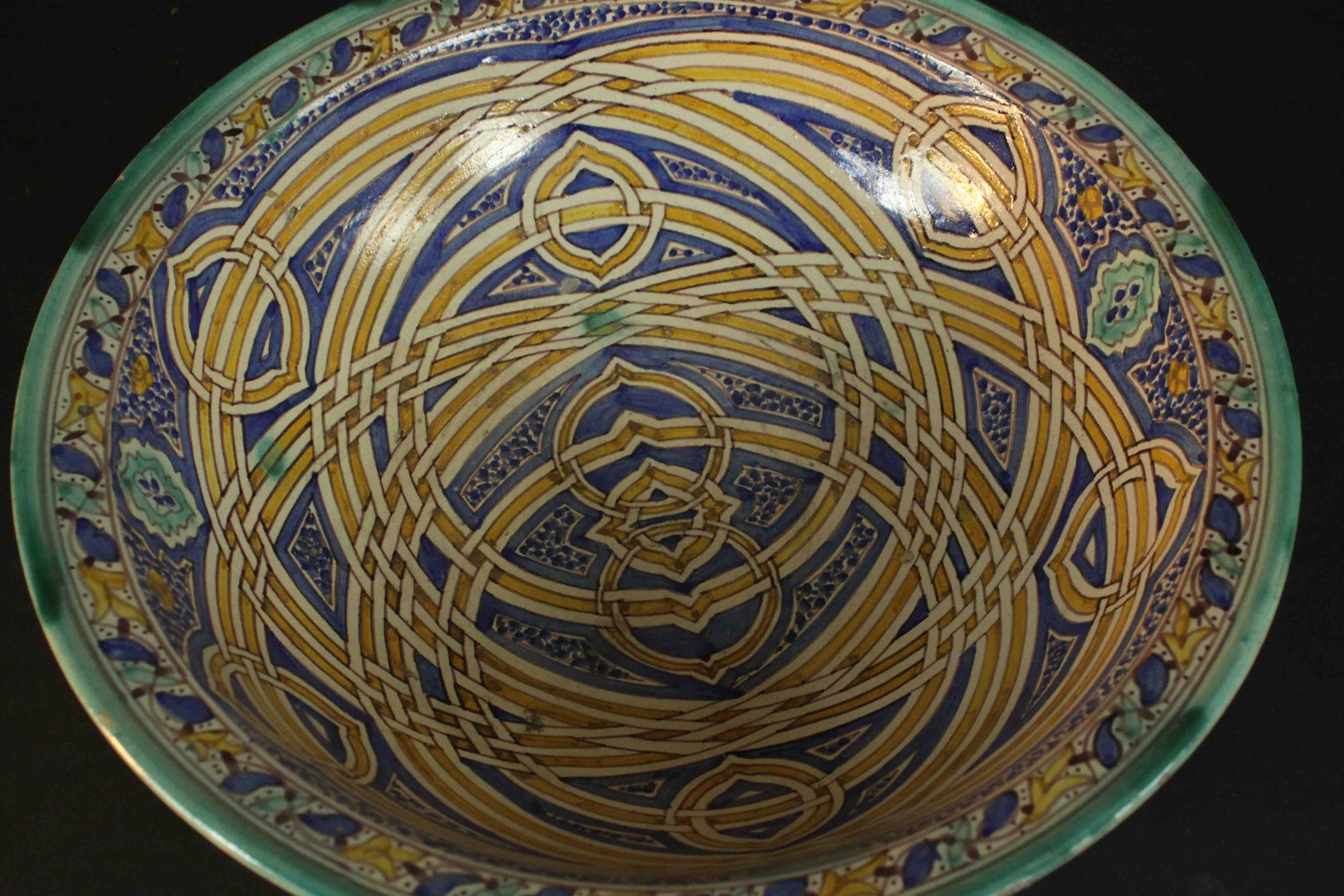 A large early 20th century Moroccan interlocking ring pattern hand painted ceramic bowl. H.13 Dia. - Image 5 of 7