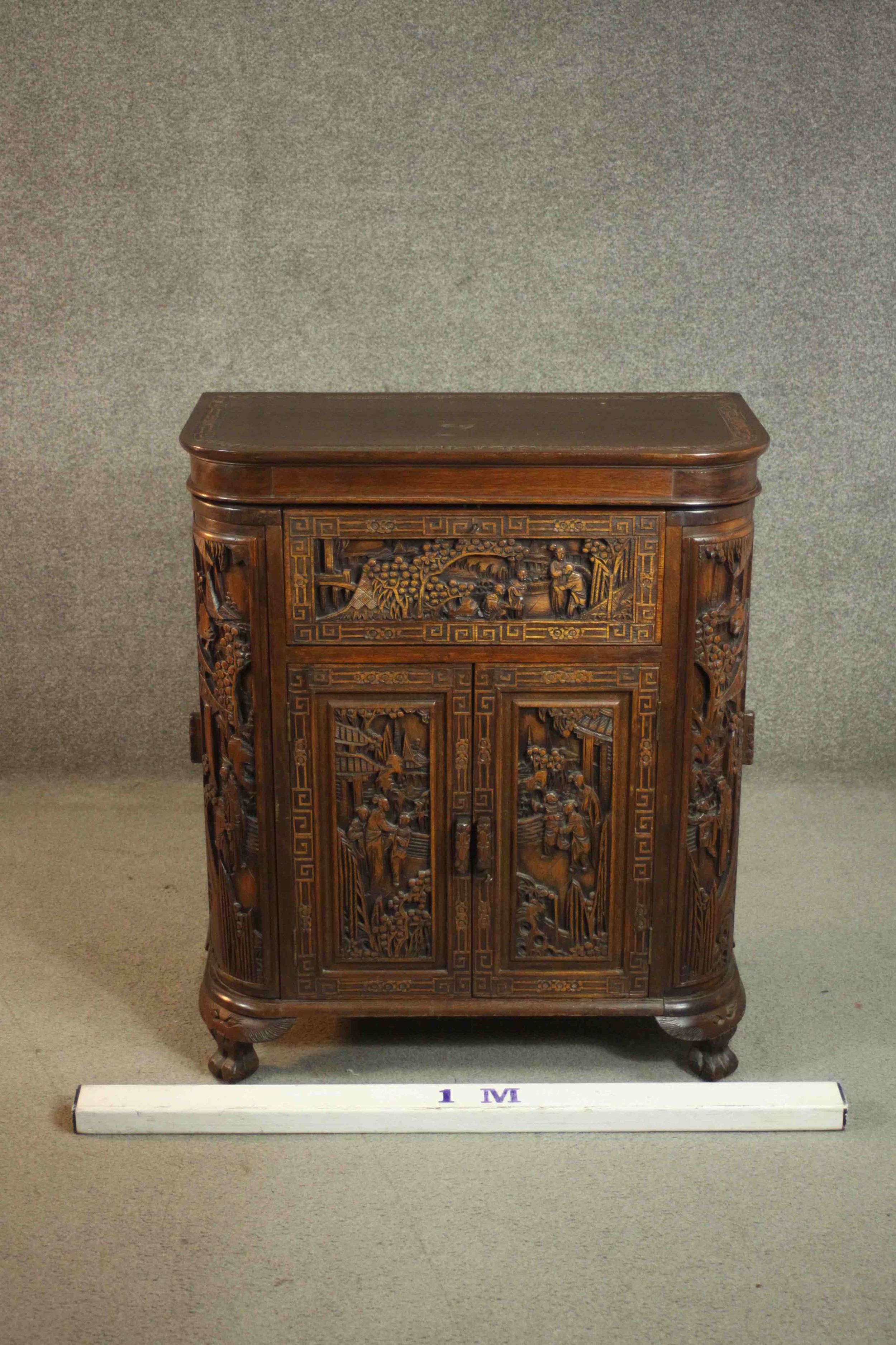 An early 20th century Chinese carved hardwood cabinet with central fitted drinks section. H.87 W. - Image 2 of 14
