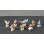 A collection of eight Royal Worcester hand painted porcelain British birds. Stamped to base. H.7 W.
