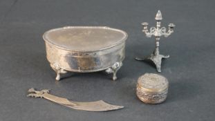 A collection of silver items, including a miniature silver candelabra (hallmarked: IF, London,