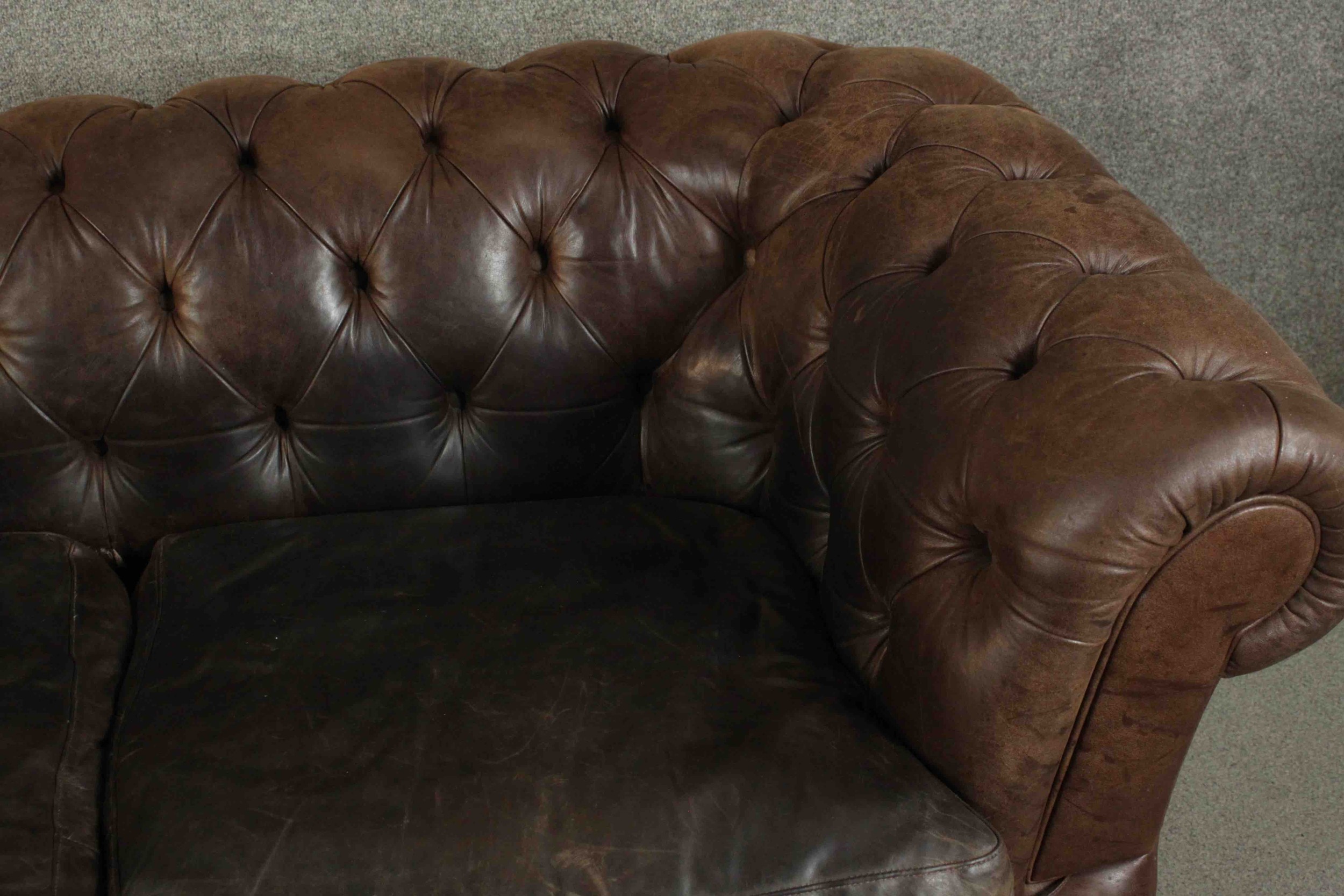 A contemporary brown leather Chesterfield sofa, with buttoned scrolling arms and back, on turned - Image 4 of 11