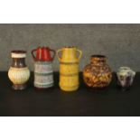A collection of five West German pottery pieces, including a twin handled raised bird and