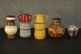 A collection of five West German pottery pieces, including a twin handled raised bird and