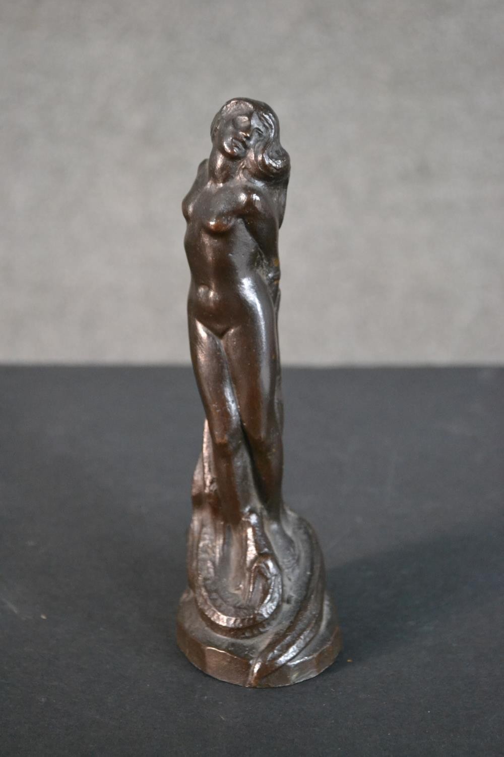 A 20th century bronze figurine of a nude woman tied at a stake with dragon at her feet. Dated - Image 2 of 8