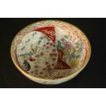 A Japanese 19th century satsuma ware hand painted bowl decorated with flowers and roosters.