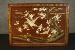 A 19th century Japanese inlaid bone and mother of pearl hardwood panel with gilded lacquer