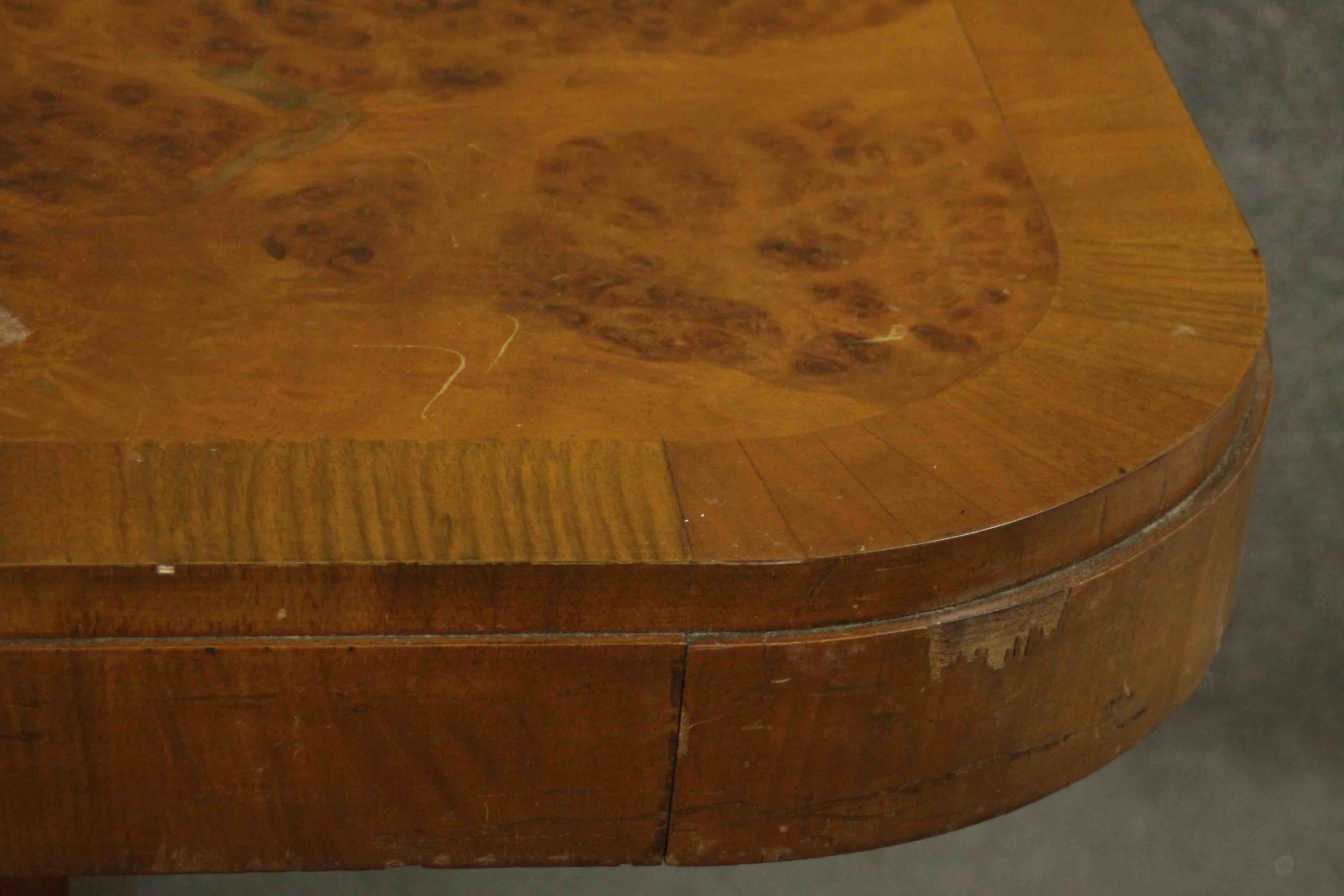 An Art Deco burr walnut and crossbanded dining table with rounded rectangular top on twin pillar - Image 9 of 9