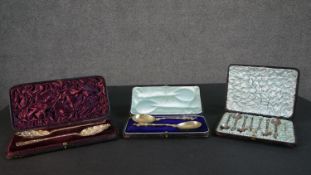 A collection of silver and brass spoons, including a leather cased set of gilded Georgian berry