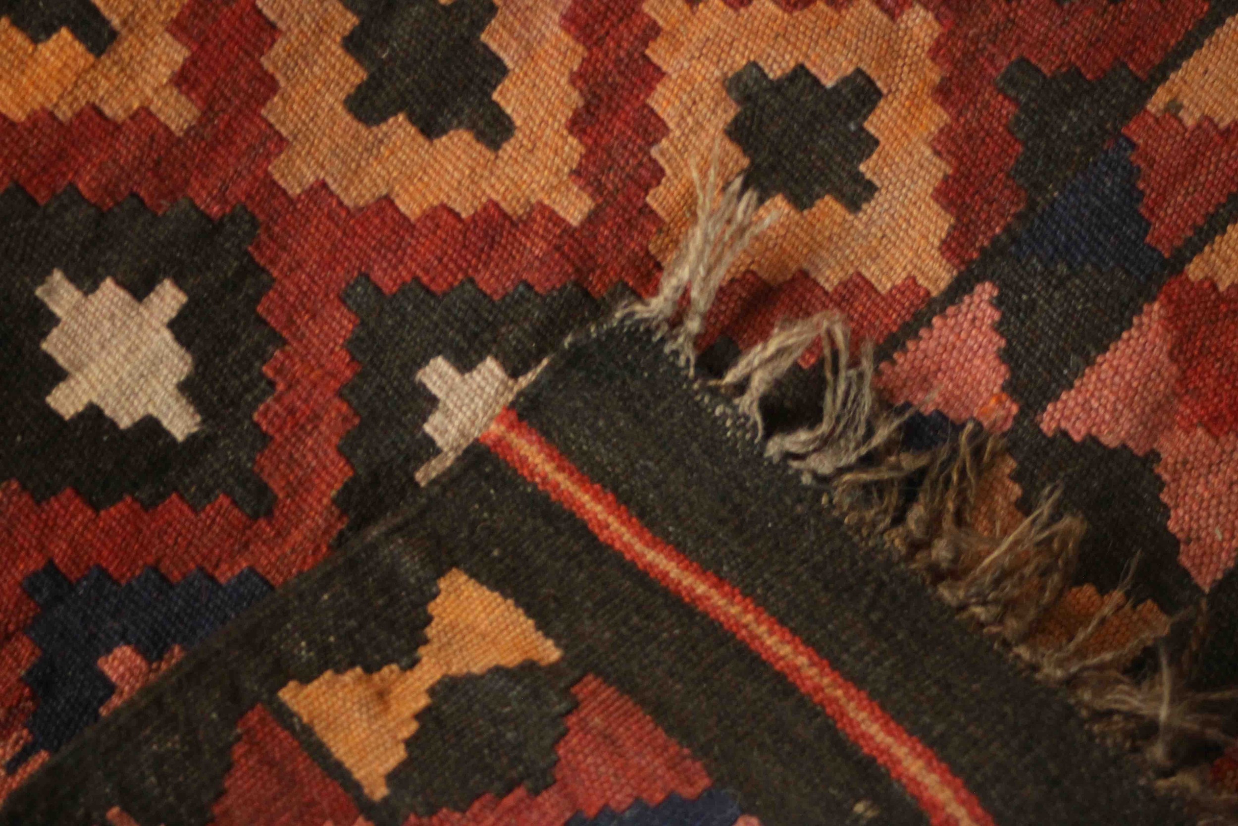 An Afghan Kelim rug with repeating diamond motif on a terracotta ground. L.94 W.69cm. - Image 5 of 5