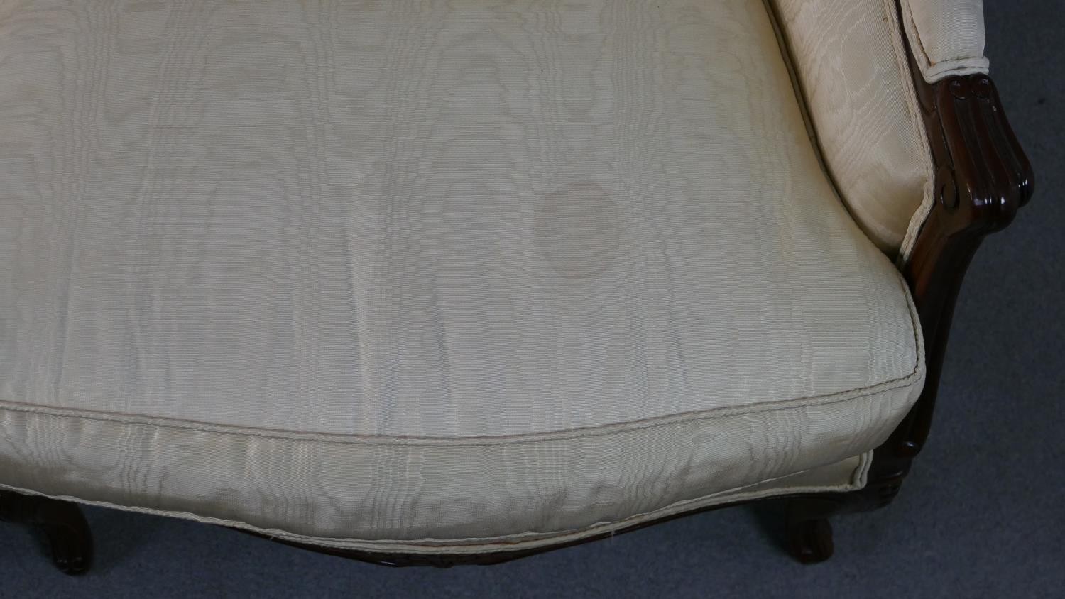 A late 20th century French show wood two seater sofa, with a carved frame, upholstered in cream - Image 6 of 7
