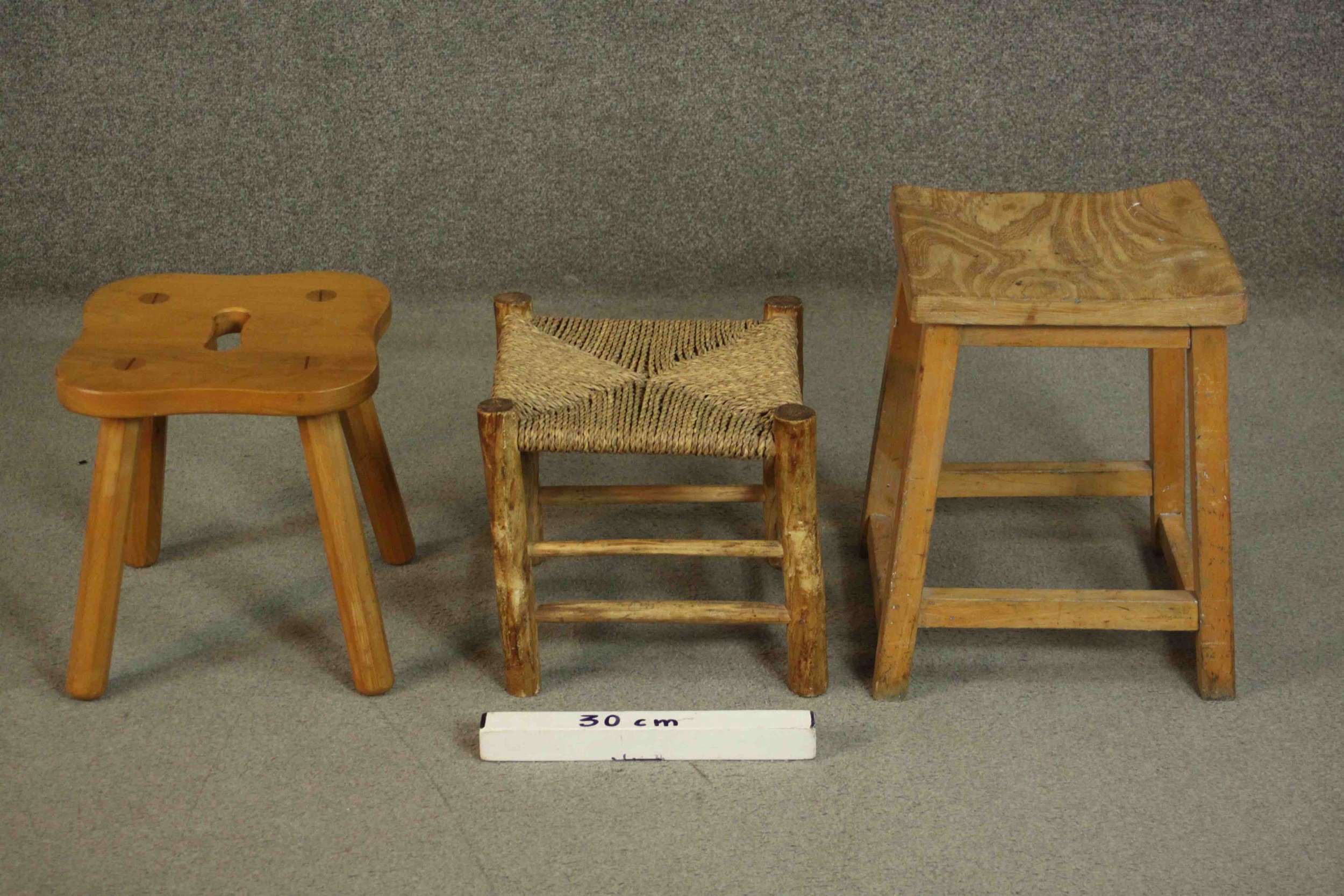 A collection of three stools, including an elm example with a shaped seat and hand hole, a stool - Image 2 of 5