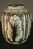 A Chinese early 20th century Cizhou ware vase with all over foliate decoration. H.26 Dia.19cm.