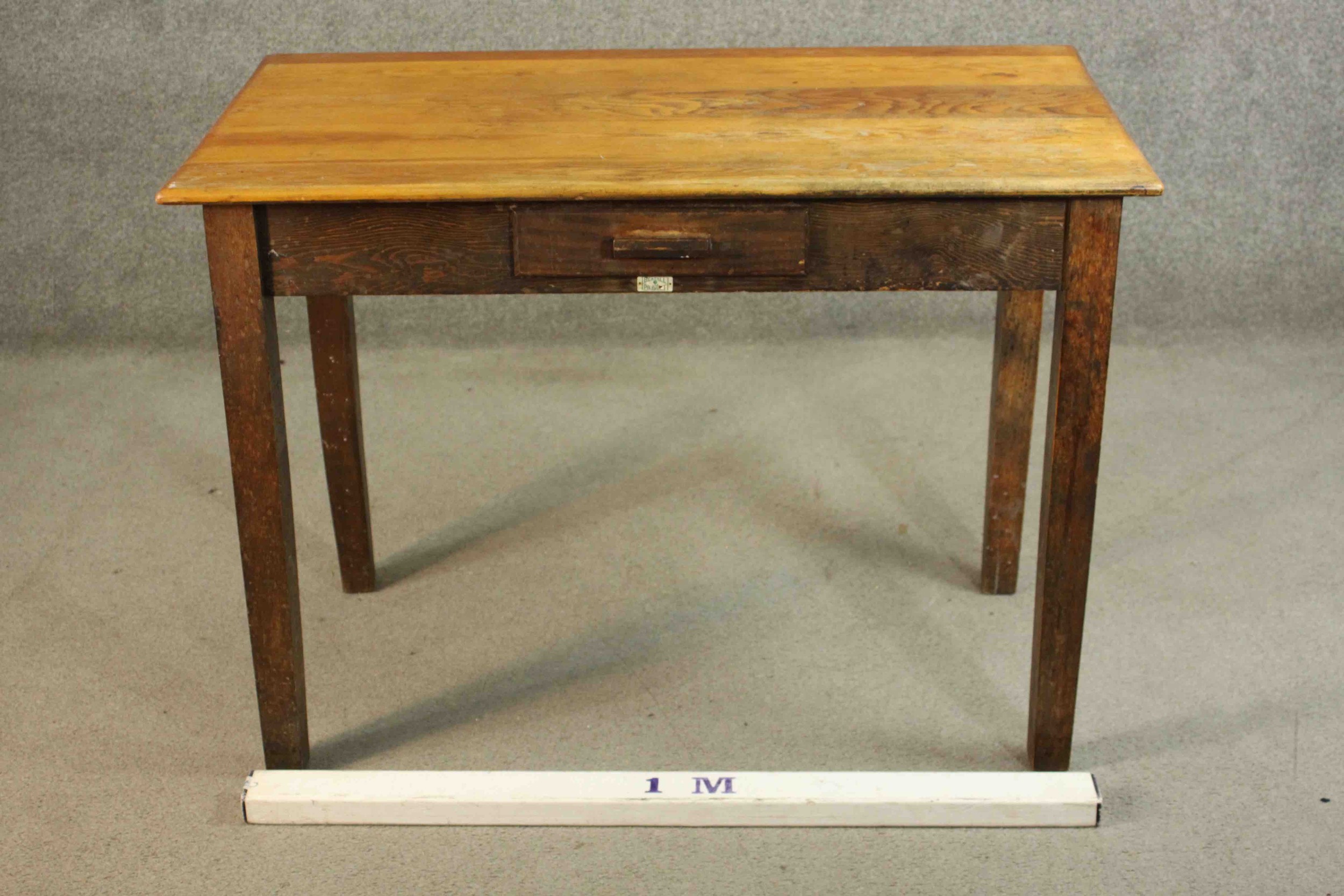 A vintage oak writing table with frieze drawer and maker's label on square supports. H.76 W105 D. - Image 2 of 7