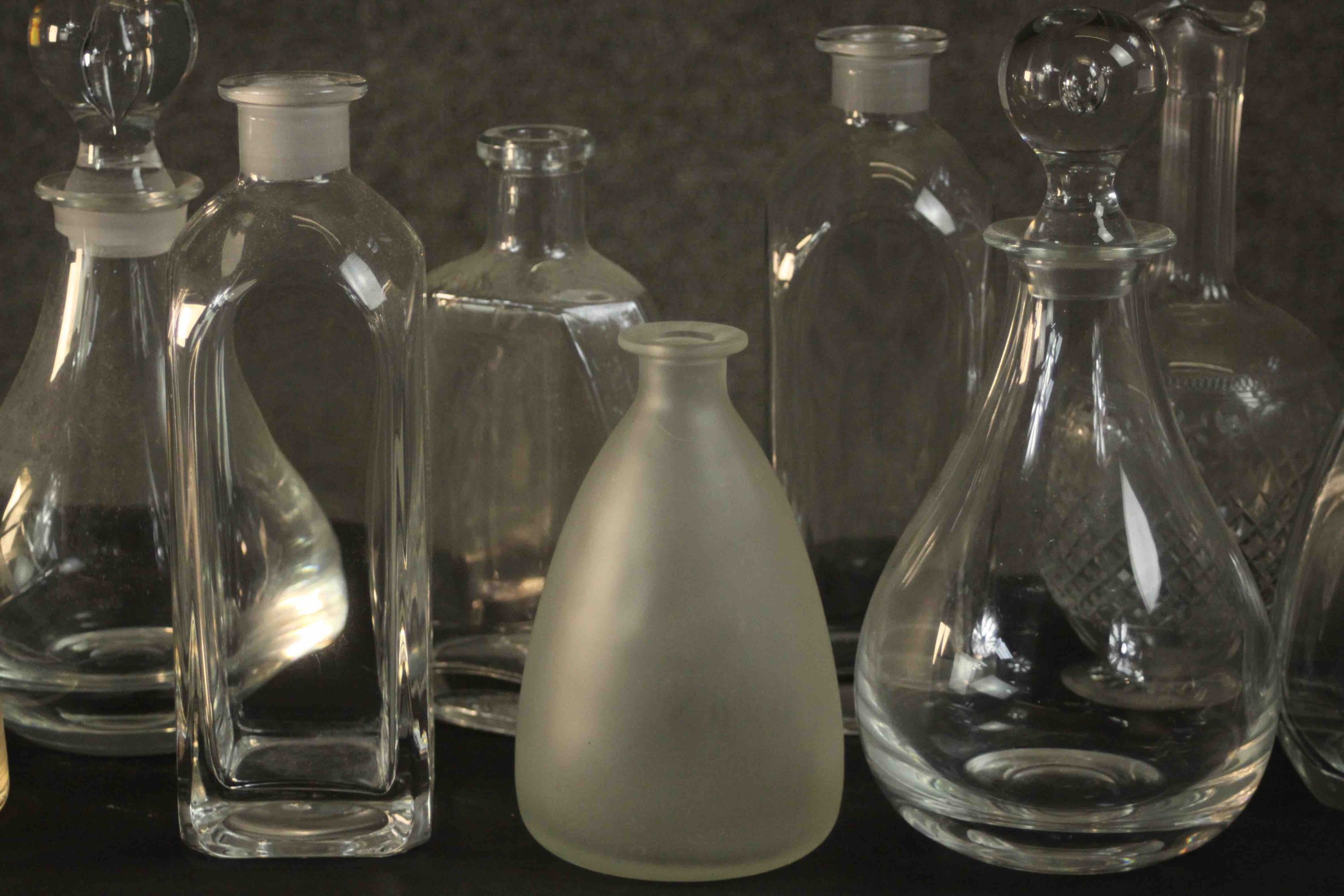A collection of nine glass decanters, two clear crystal with blown glass stoppers. H.26 Dia.12cm. ( - Image 8 of 8