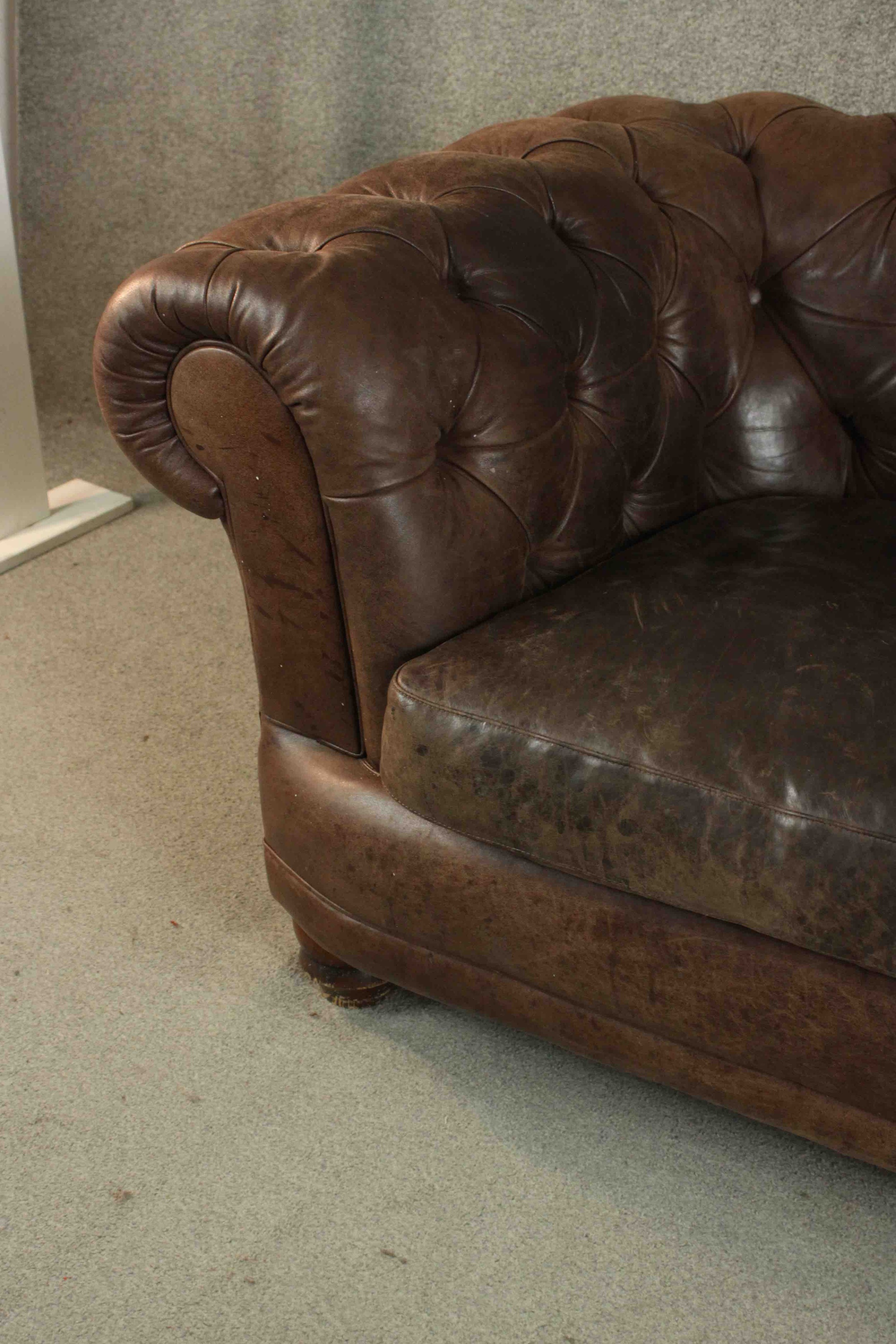 A contemporary brown leather Chesterfield sofa, with buttoned scrolling arms and back, on turned - Image 7 of 11