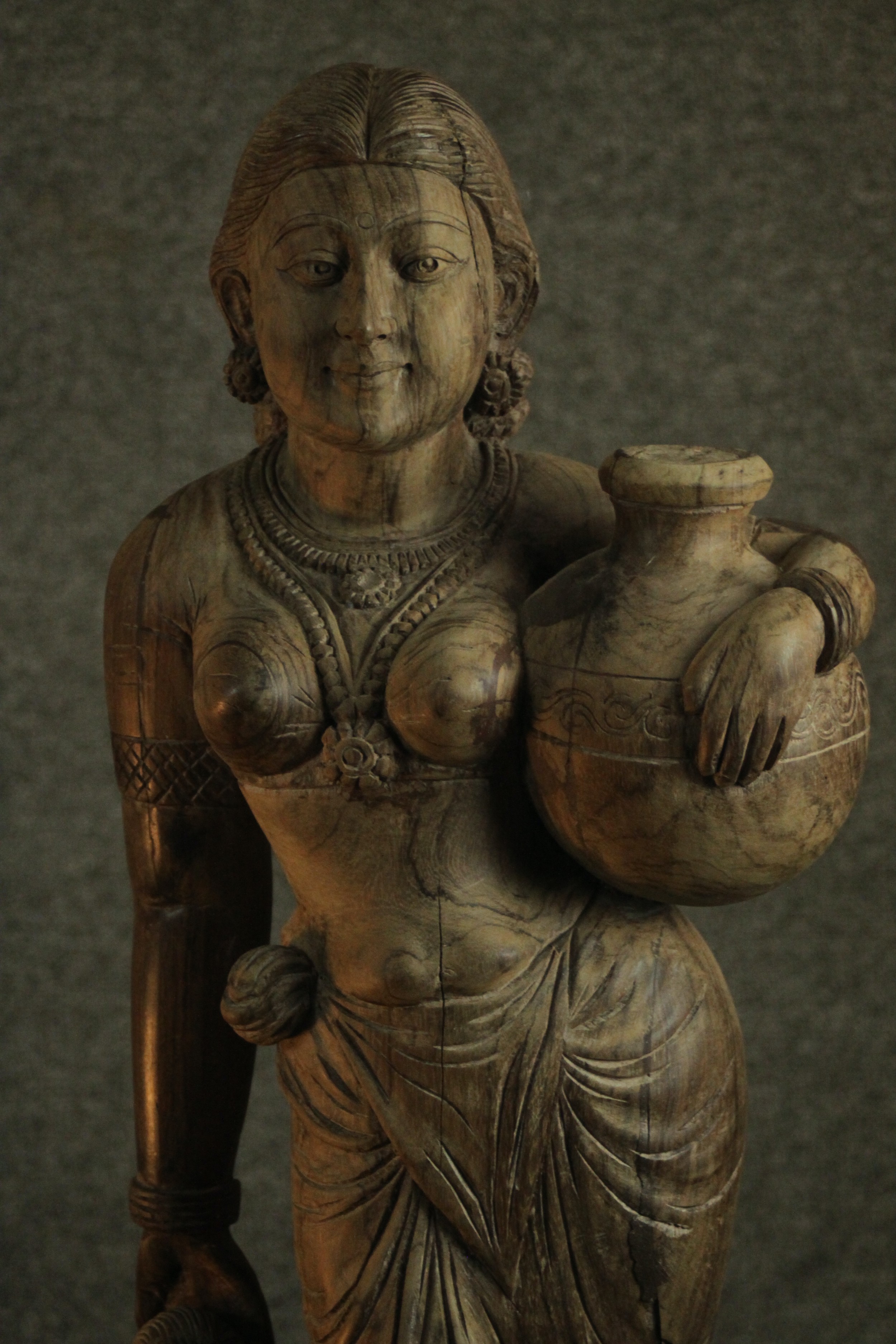A 20th century carved figure of a woman holding her child's hand and carrying a water vessel. H.78 - Image 3 of 10