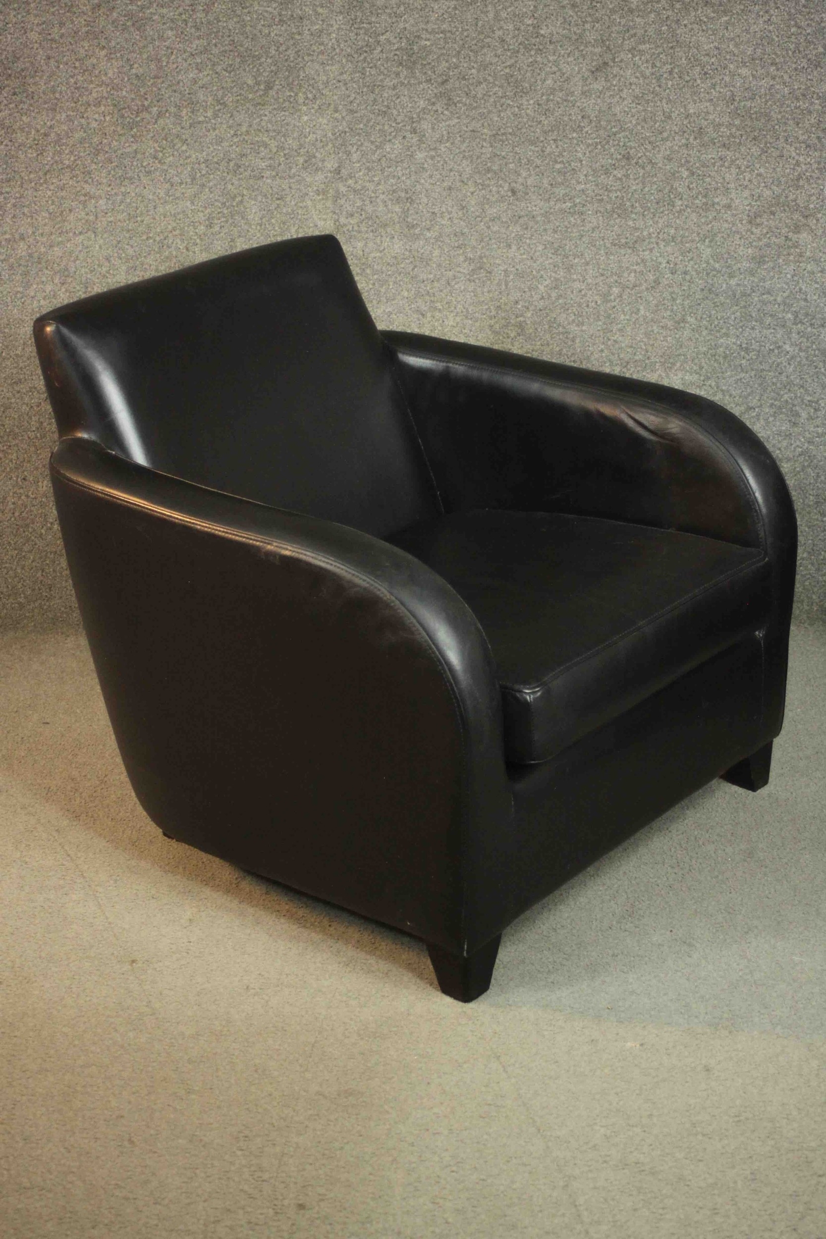 A pair of contemporary black leather armchairs, on tapering block feet. - Image 7 of 8