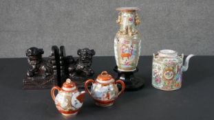 A pair of carved soapstone Foo Dog bookends along with a Japanese hand painted tea pot and sugar