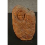 Tacita Fontana, a wooden carving of mother and child, signed to the back and label verso. H.20 W.
