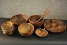 A collection of ten carved bowls, one with sections. H.12 Dia.20cm