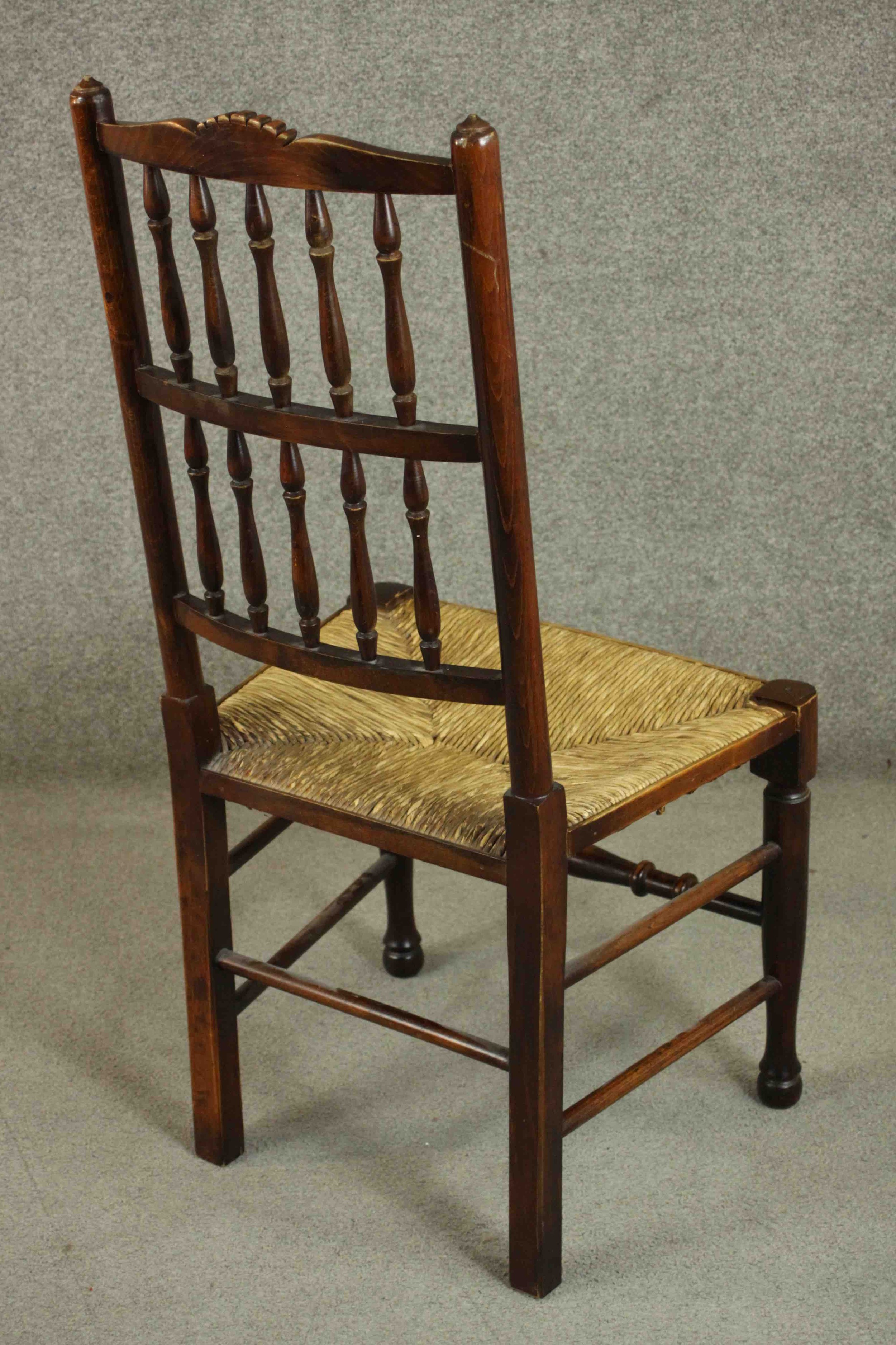 A set of four Lancashire stained beech country dining chairs, with a splindle back, over a rush - Image 4 of 10