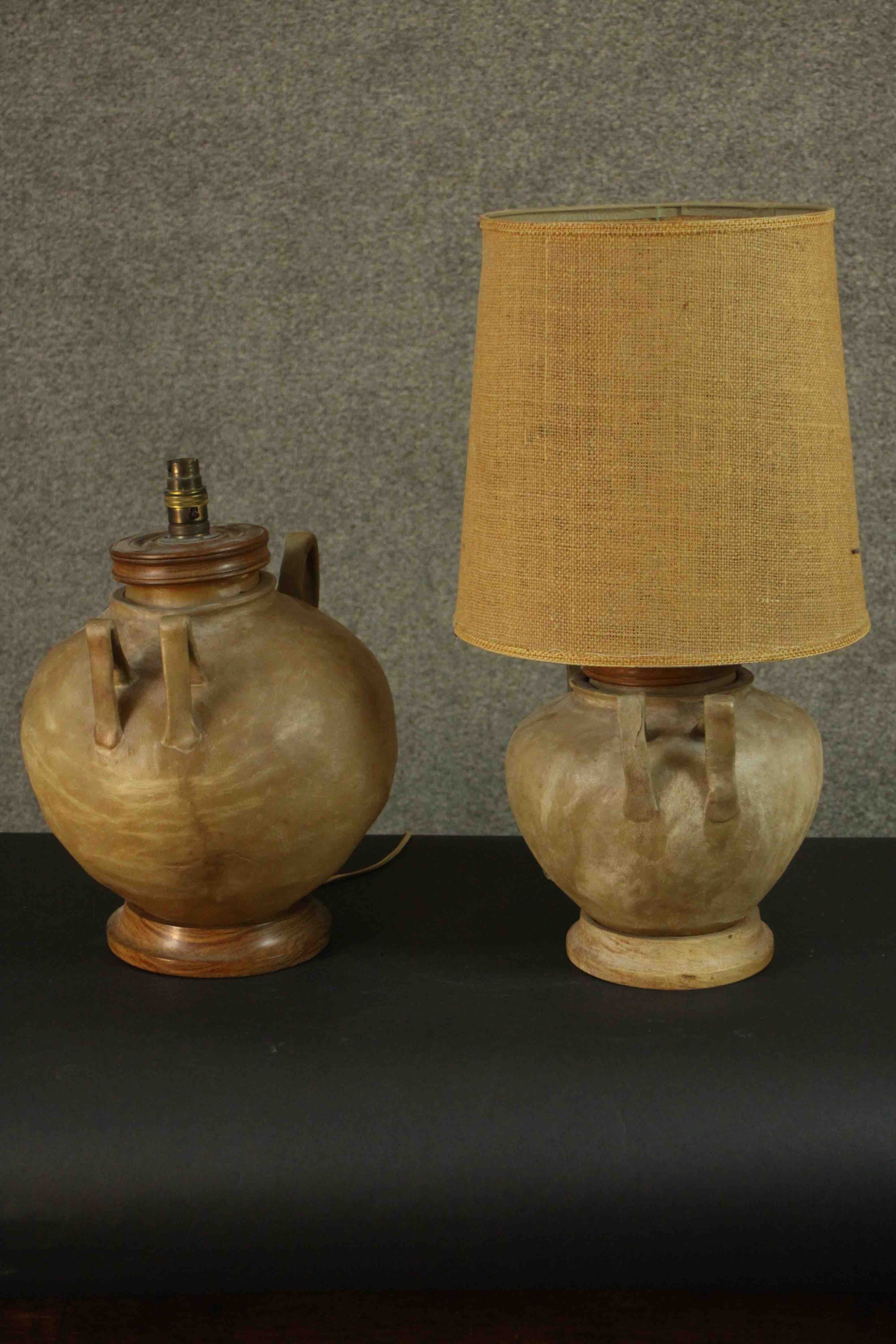 A pair of camel intestine twin handled table lamps with turned tops and bases. H.57 Dia.13cm.