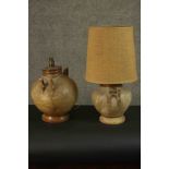 A pair of camel intestine twin handled table lamps with turned tops and bases. H.57 Dia.13cm.