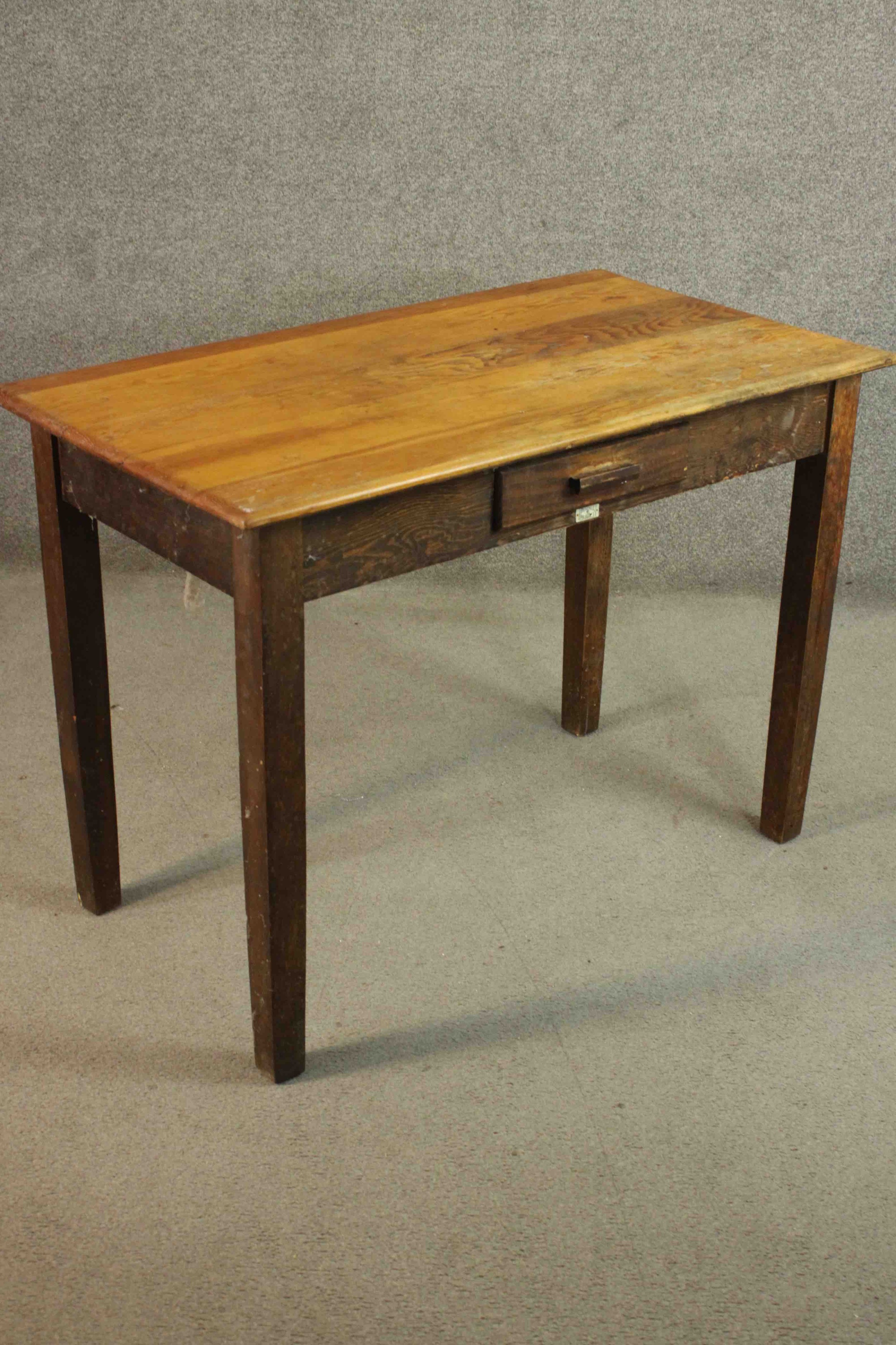 A vintage oak writing table with frieze drawer and maker's label on square supports. H.76 W105 D. - Image 4 of 7