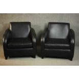 A pair of contemporary black leather armchairs, on tapering block feet.