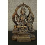 A large 20th century brass figure of an Indian deity. H.32 W.20 D.12cm.