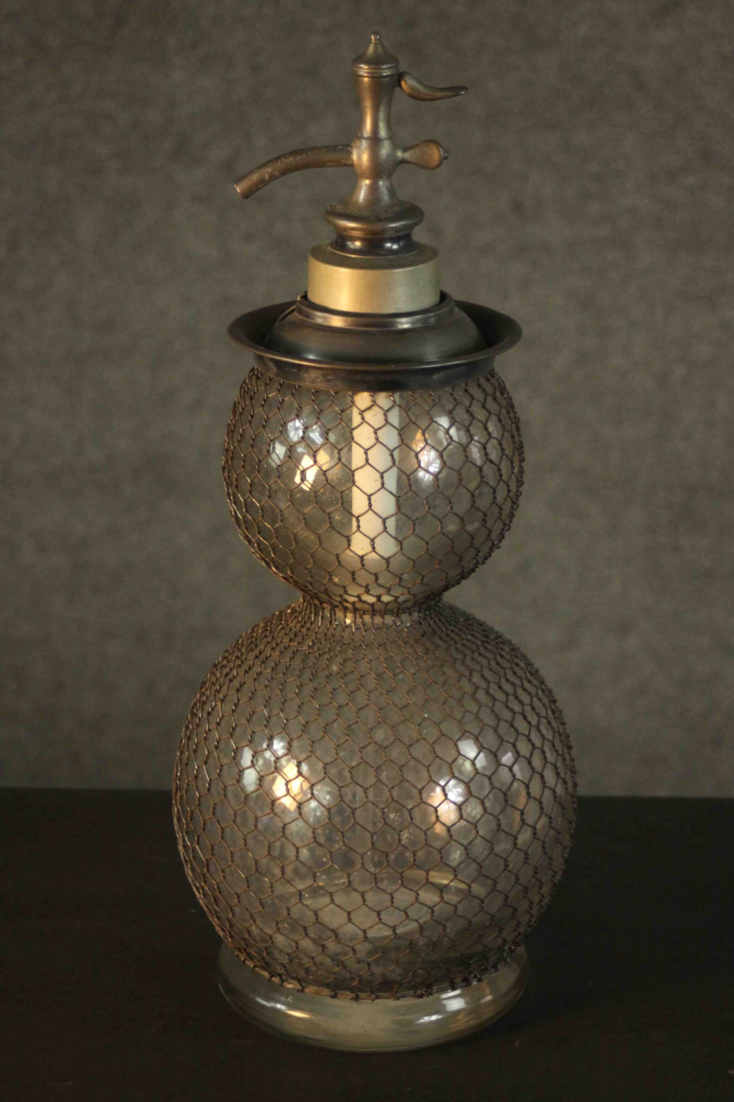 An antique French double gourd glass and mesh soda siphon. H.48.5 Dia.20cm.