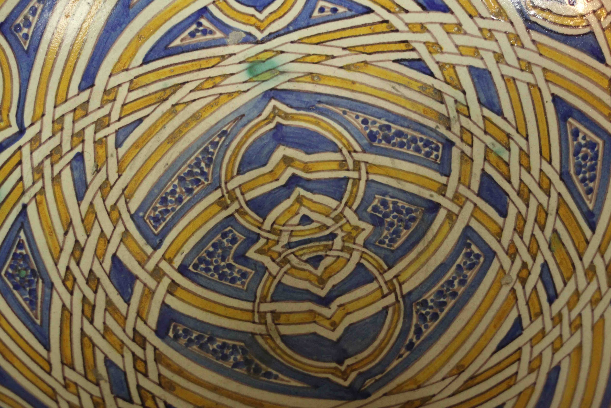 A large early 20th century Moroccan interlocking ring pattern hand painted ceramic bowl. H.13 Dia. - Image 4 of 7