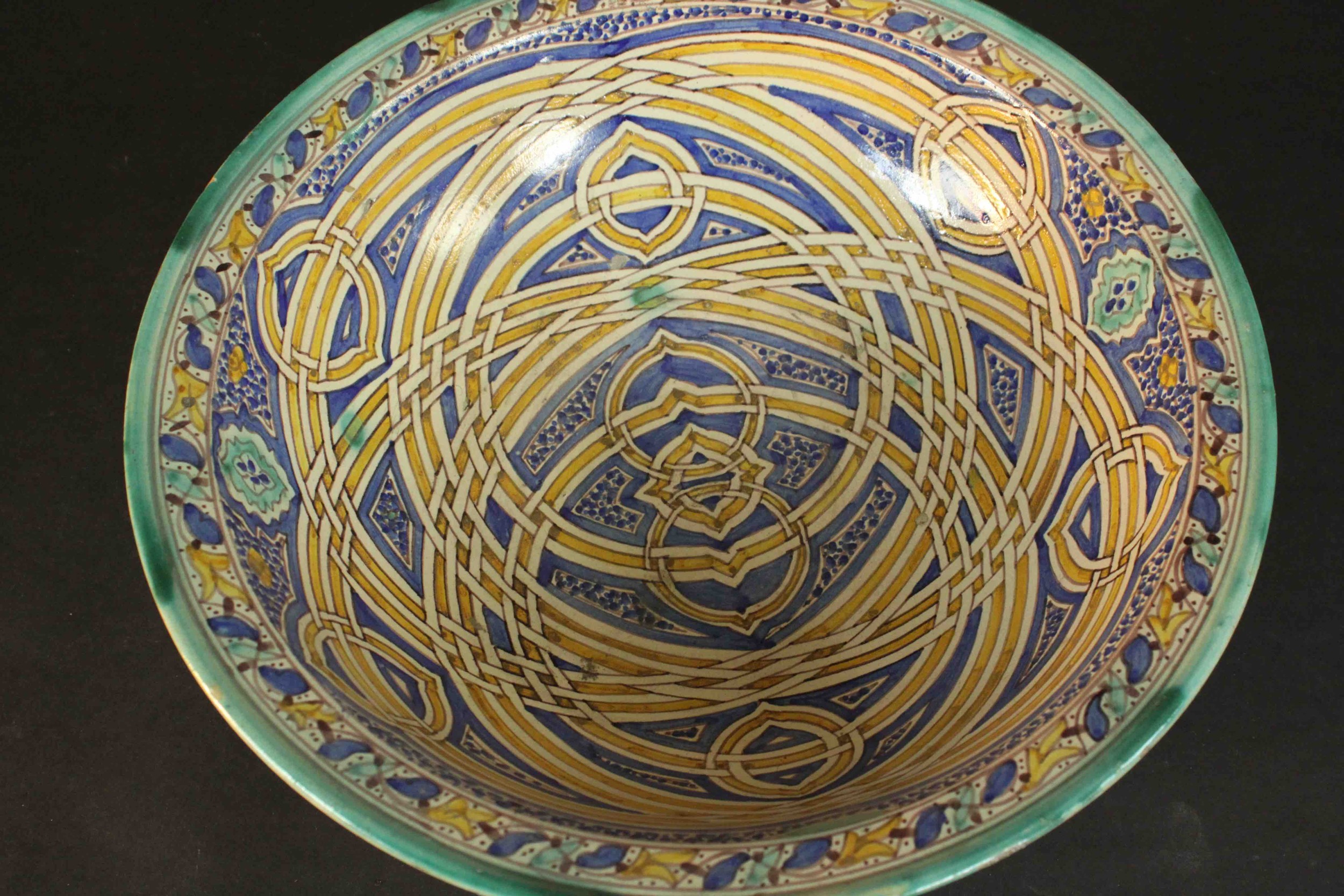 A large early 20th century Moroccan interlocking ring pattern hand painted ceramic bowl. H.13 Dia. - Image 3 of 7