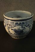 A 19th century Chinese blue and white hand painted ceramic planter. Decorated with panels each