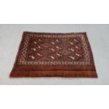 A hand made ochre ground Persian Turkmen rug. L.113 W.78cm