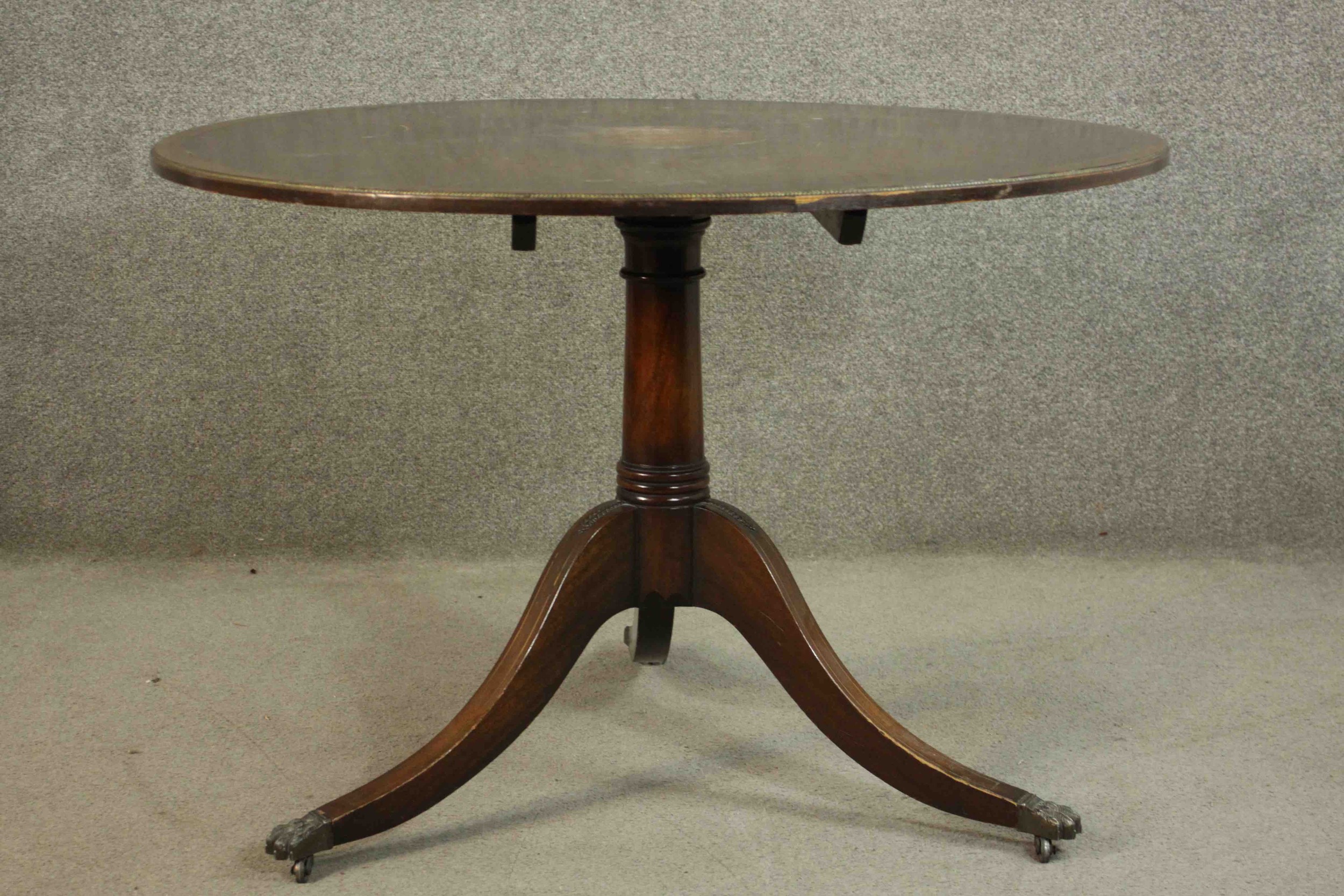 A mahogany Georgian style tilt top table on tripod swept base. H.73 Dia.106cm.