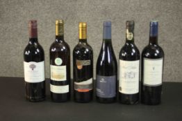 A collection of six bottles of red wine, various regions and vintages. H.30cm.