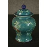A Chinese turquoise glaze relief floral and foliate design lidded ginger jar with impressed
