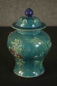 A Chinese turquoise glaze relief floral and foliate design lidded ginger jar with impressed