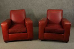 A pair of Art Deco burgundy faux leather armchairs. H.76 W.83 D.85cm.