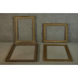 A collection of four large picture frames, including two carved giltwood and gesso frames with