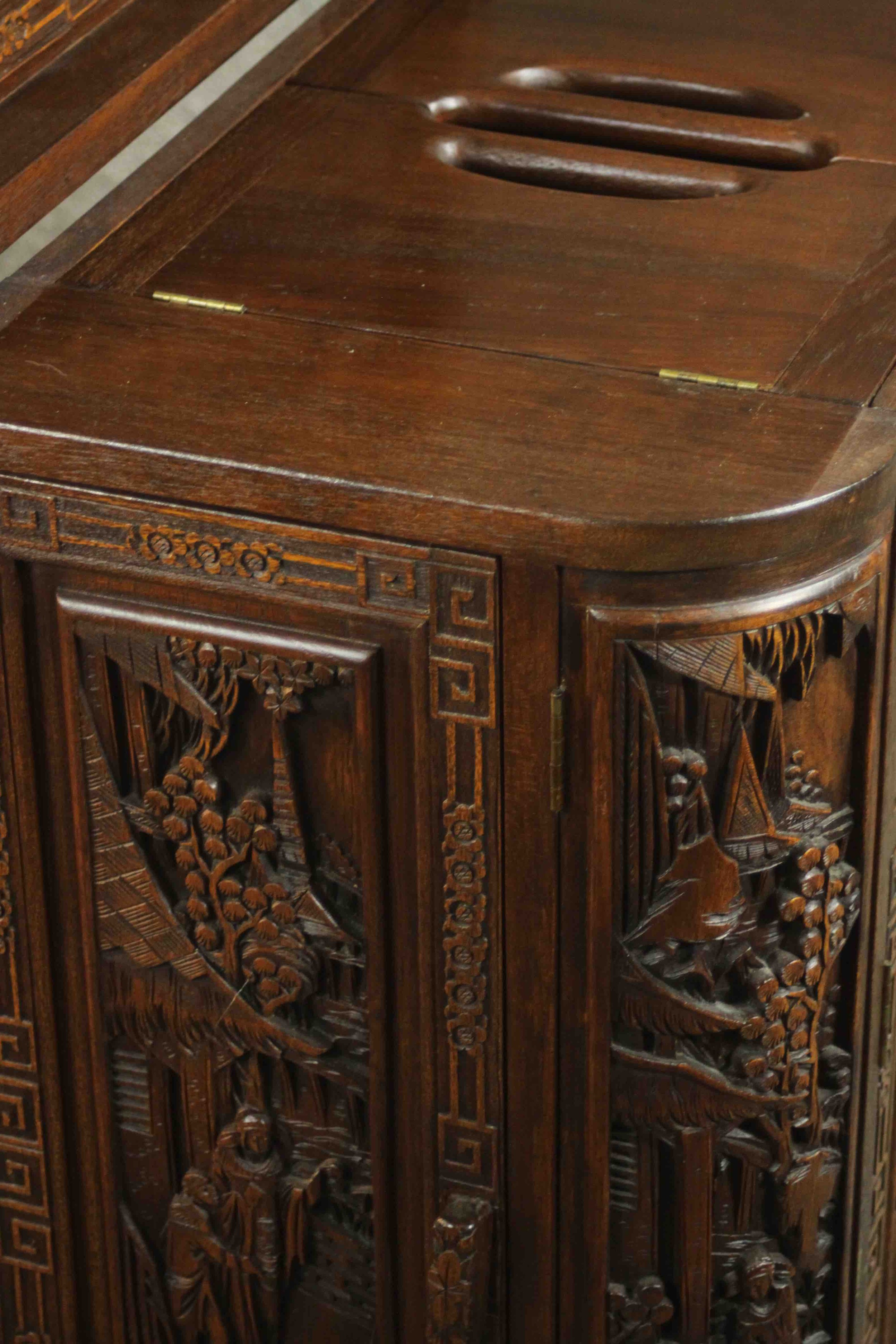 An early 20th century Chinese carved hardwood cabinet with central fitted drinks section. H.87 W. - Image 14 of 14