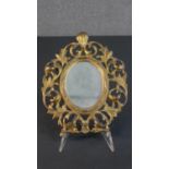 A Victorian gilt spelter pierced scrolling foliate design wall mirror. H..27 W.22cm