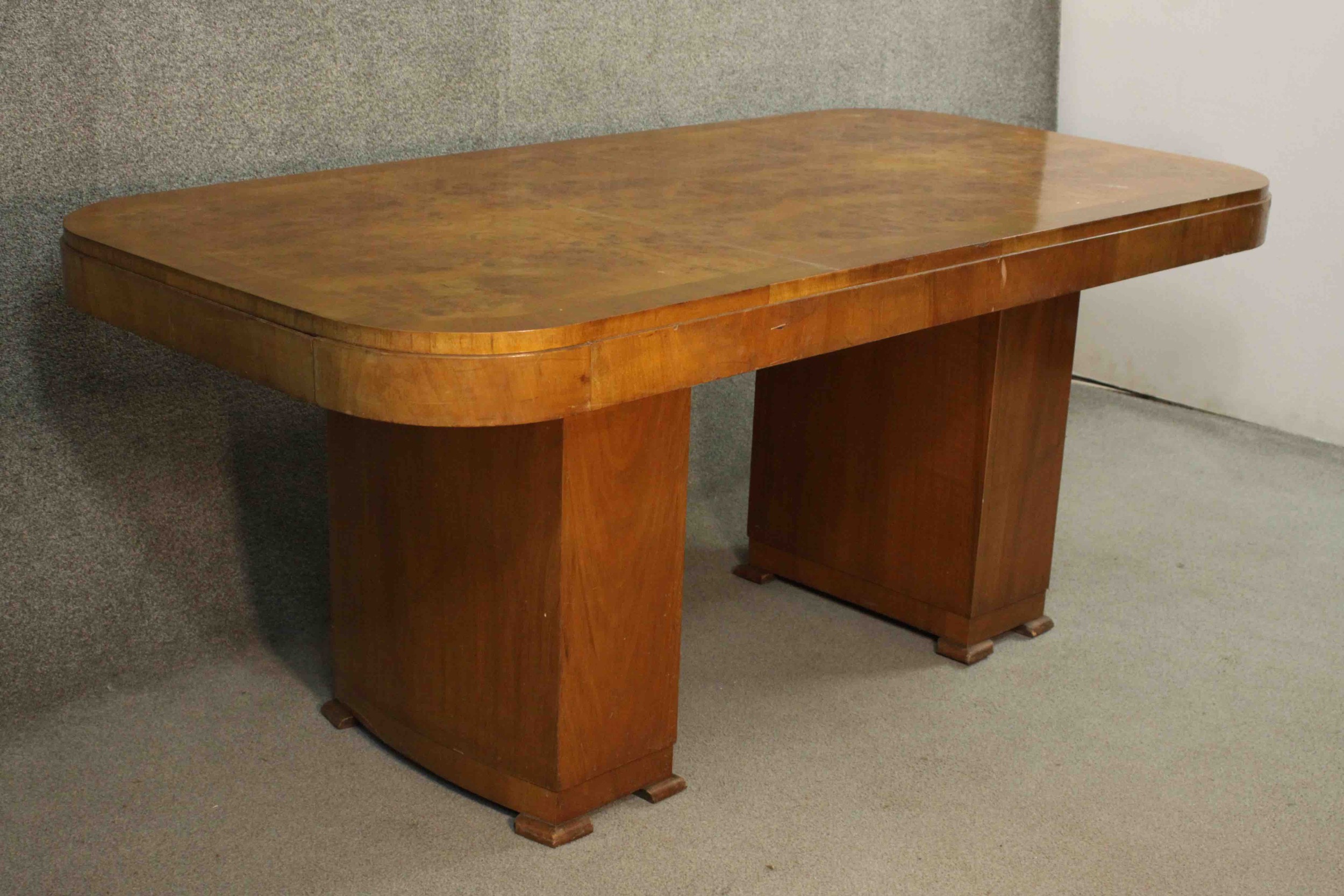 An Art Deco burr walnut and crossbanded dining table with rounded rectangular top on twin pillar - Image 5 of 9