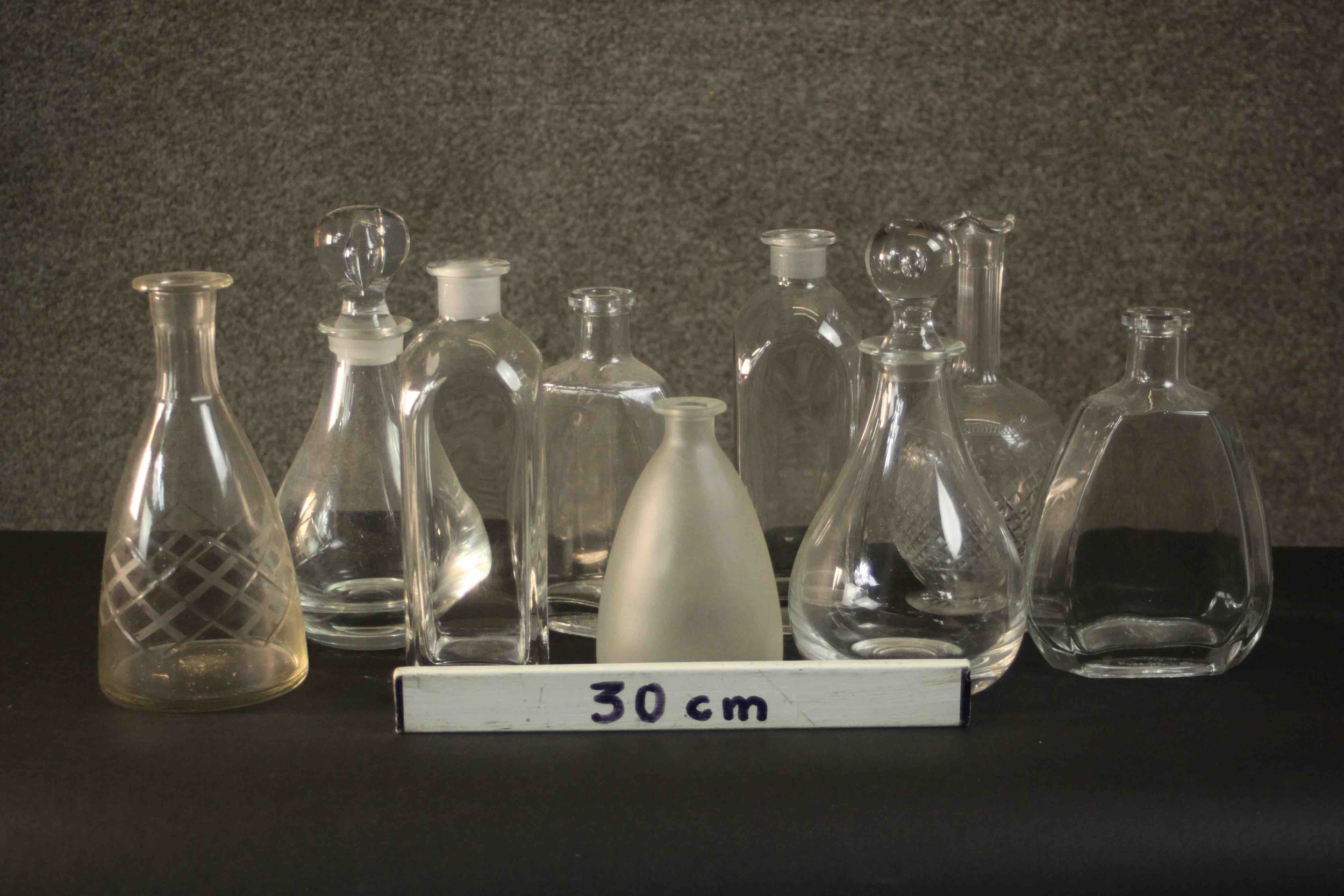 A collection of nine glass decanters, two clear crystal with blown glass stoppers. H.26 Dia.12cm. ( - Image 2 of 8