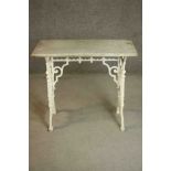 A 19th century white painted cast iron table, the rectangular white marble top with a moulded