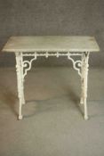 A 19th century white painted cast iron table, the rectangular white marble top with a moulded