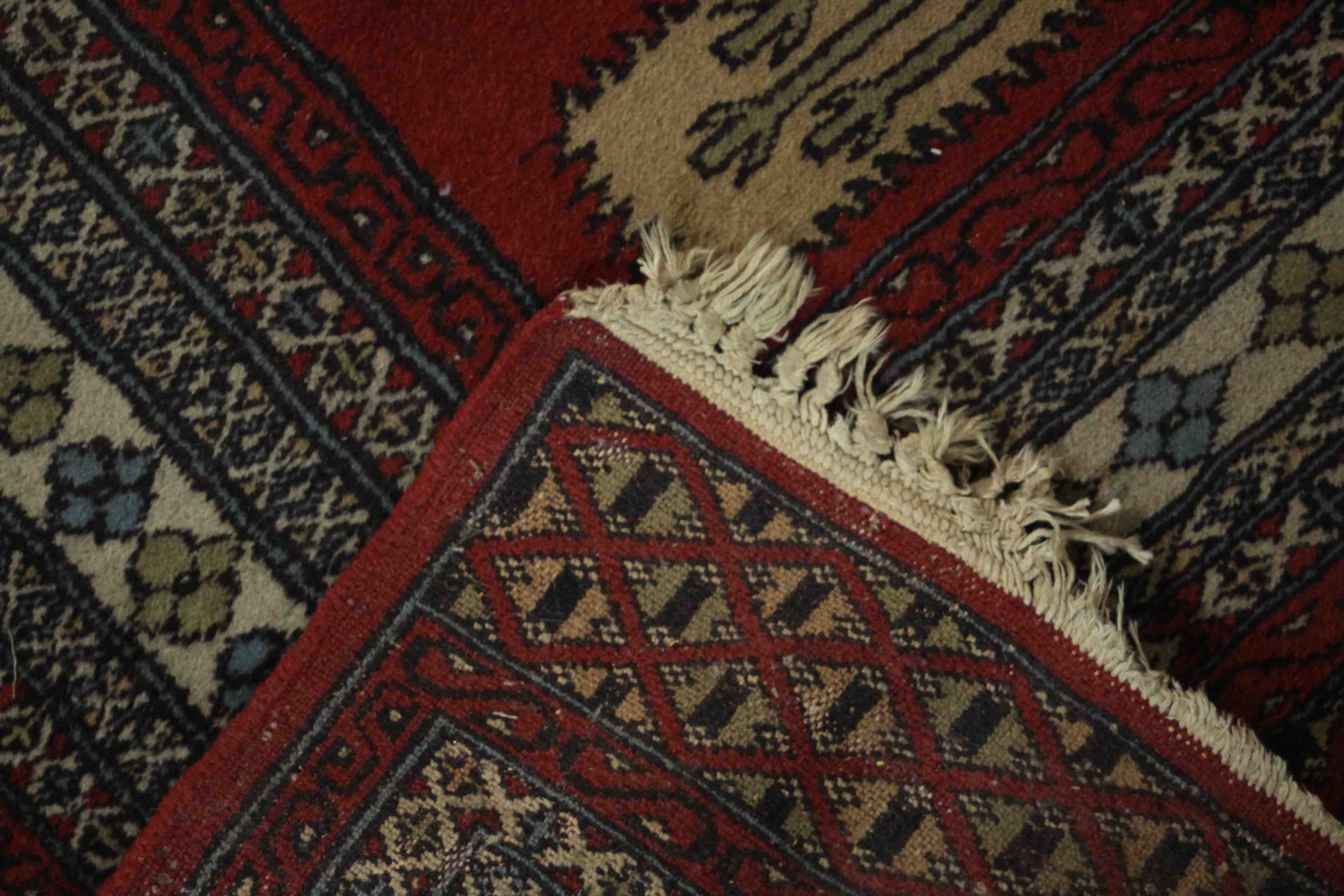 A Pakistan Bokhara with repeating diamond motifs on a burgundy field within stylised flowerhead - Image 6 of 6