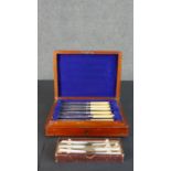 A canteen of fish knives for four people with engraved silver plated blades along with a box of