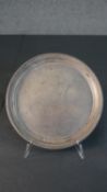 A Victorian sterling silver circular tray with beaded edging. Engraved inscription. Hallmarked: HA